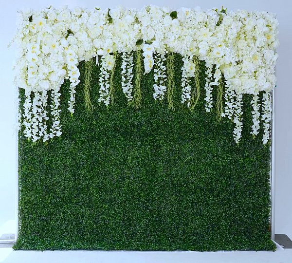 Greenery Wall with white floral on top.jpg